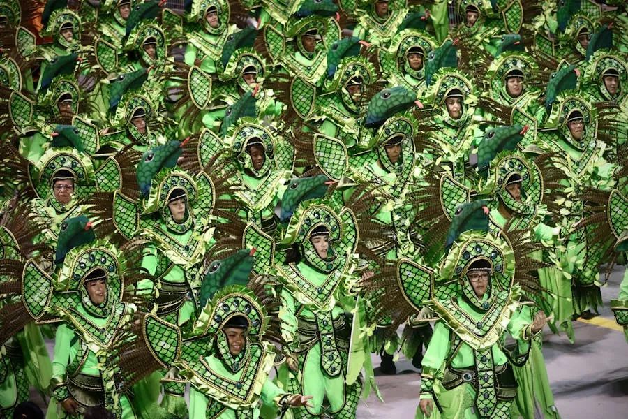 Carnival parade with colorful costumes and feathered headdresses in Brazil