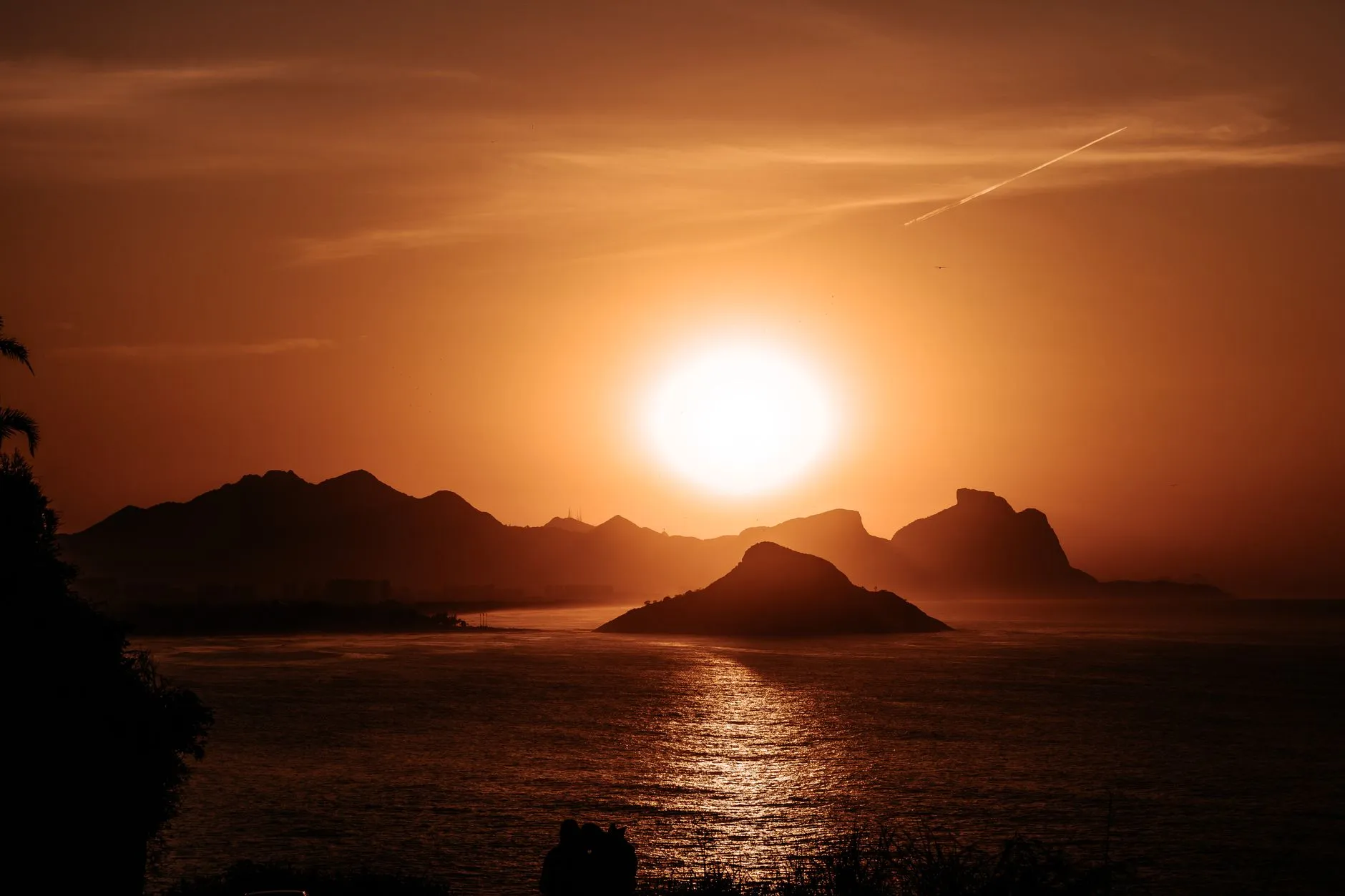 Stunning sunset view over the coastal hills and sea at Mesquita, Brazil.