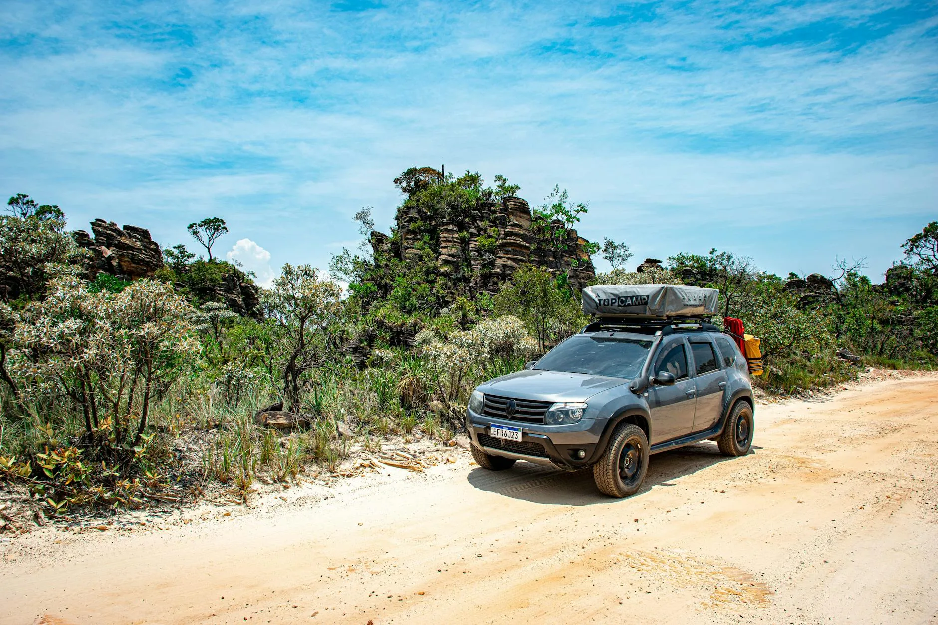 4x4 vehicle on a scenic dirt road in Serra da Canastra, Brazil, ideal for off-road adventures.