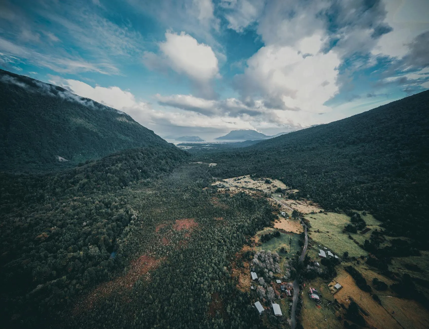 Breathtaking aerial view of lush forests and mountains in Hualaihué, Los Lagos Region, Chile.