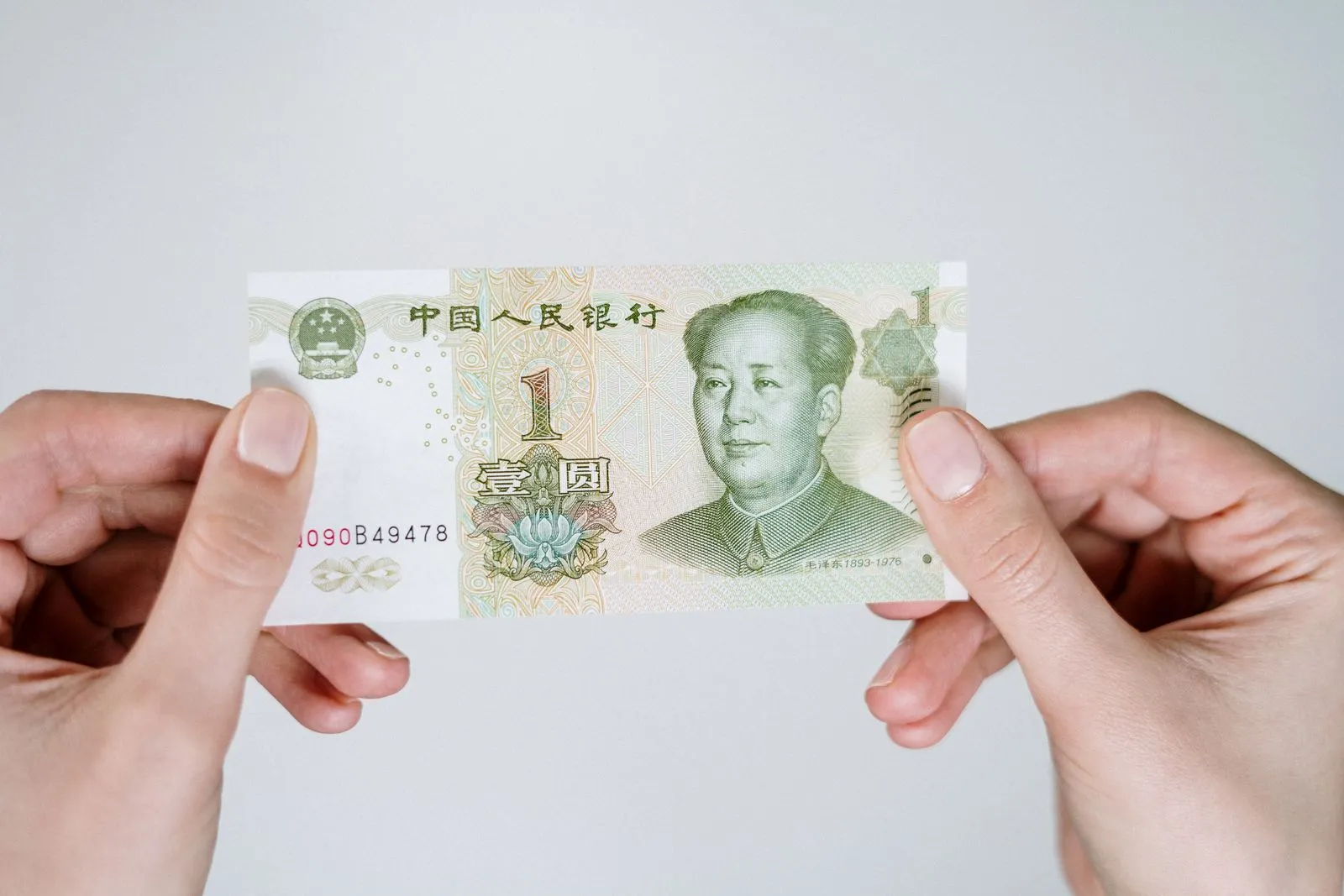 Chinese yuan banknotes and coins on a market counter