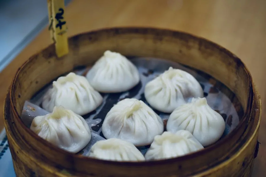 Xiaolongbao soup dumplings in a bamboo steamer