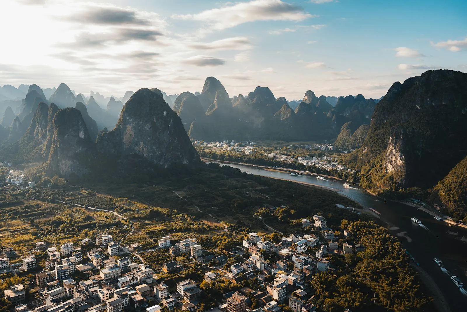 Karst mountains rising from the Li River near Guilin at golden hour