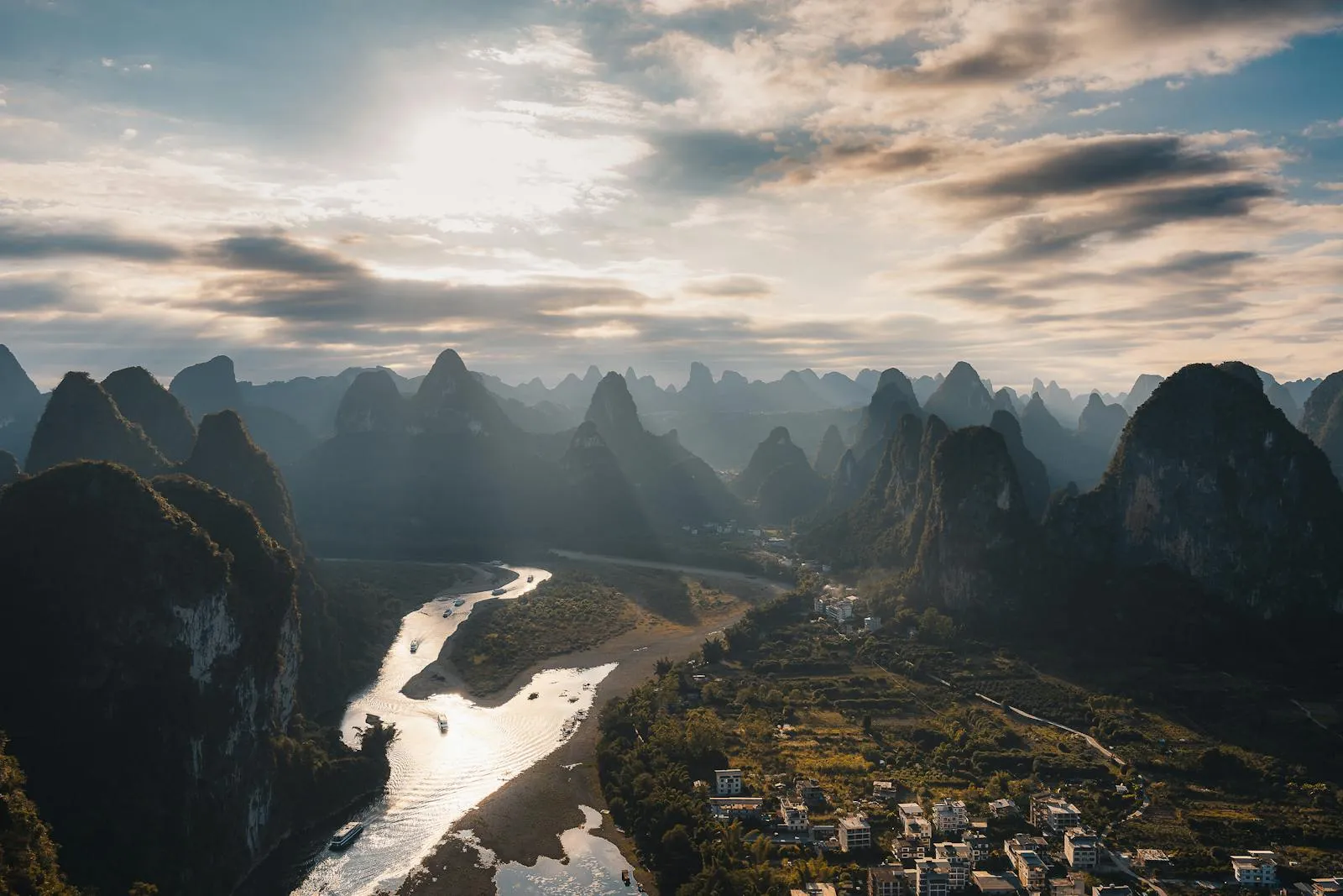 Karst mountains of Guilin reflected in the Li River at dawn