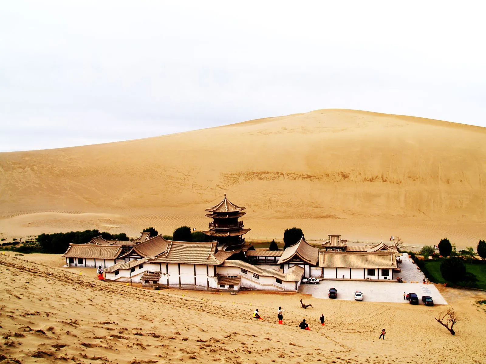 Silk Road desert landscape with sand dunes and distant mountains in Gansu province