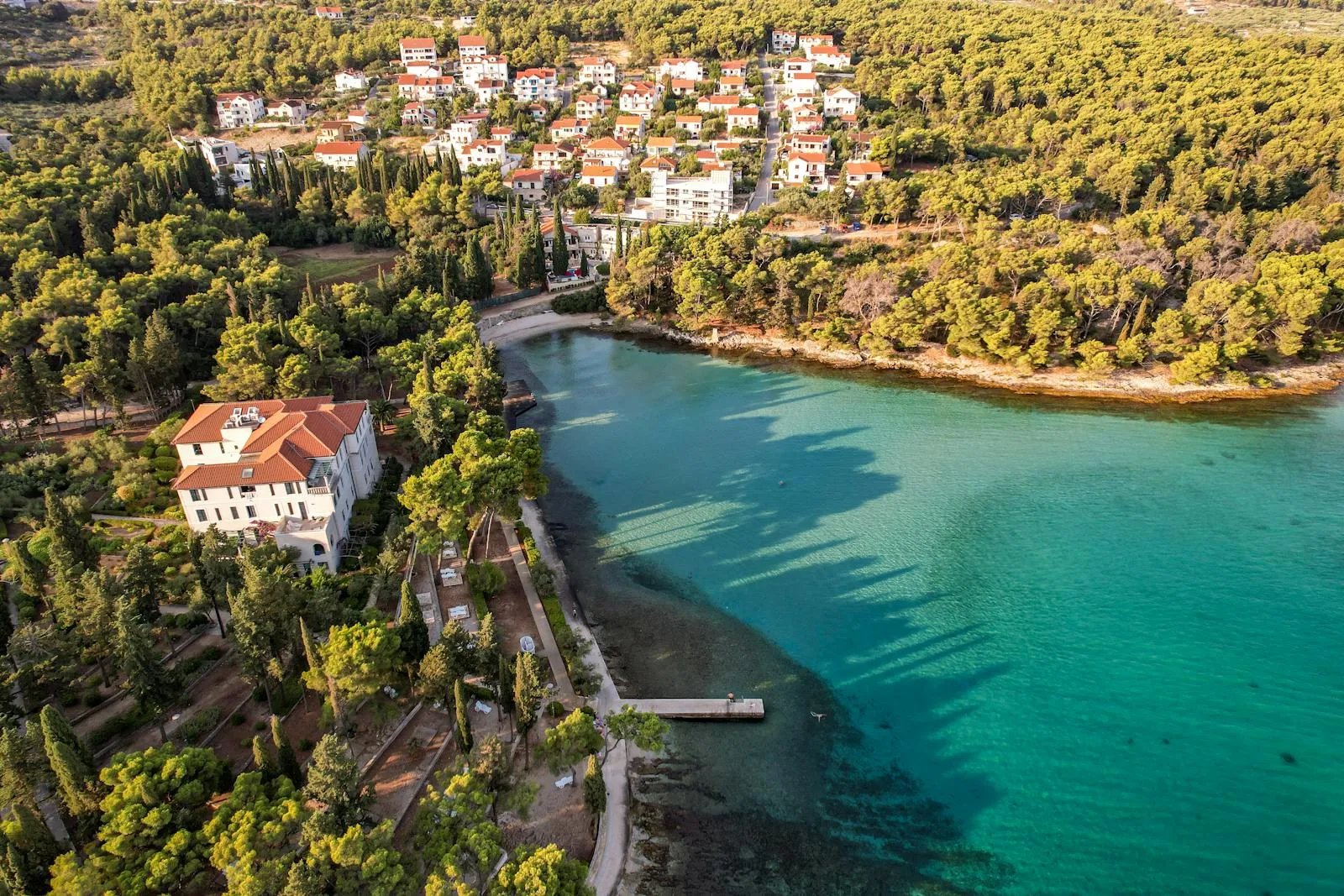 Croatian coastal town with turquoise water in late spring sunshine