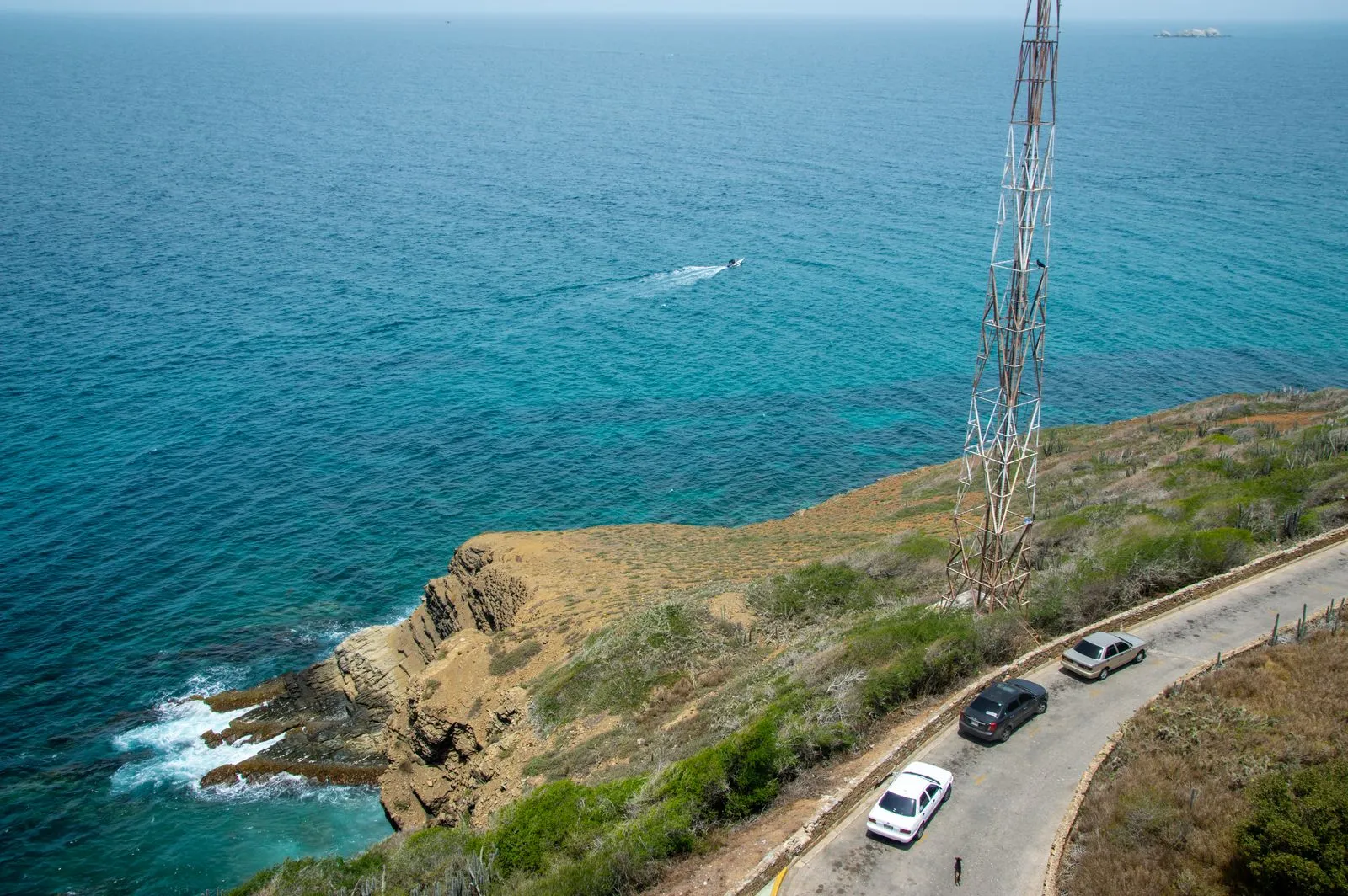 Coastal road winding along Croatian Adriatic cliffs with turquoise sea