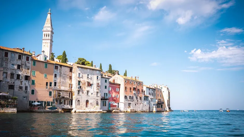 Rovinj old town peninsula with colourful buildings rising from the sea