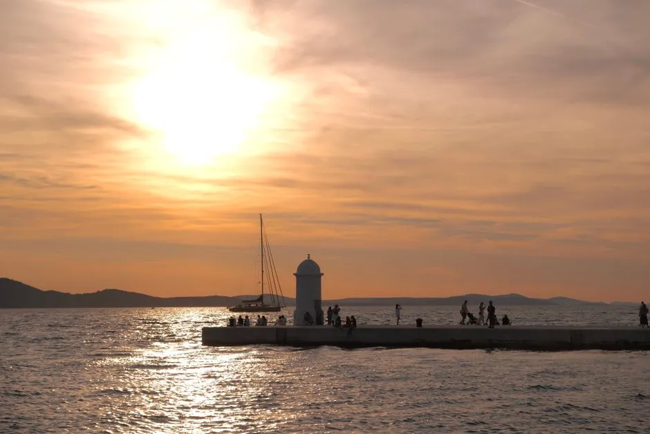 Zadar Sea Organ at sunset with golden light reflecting on water
