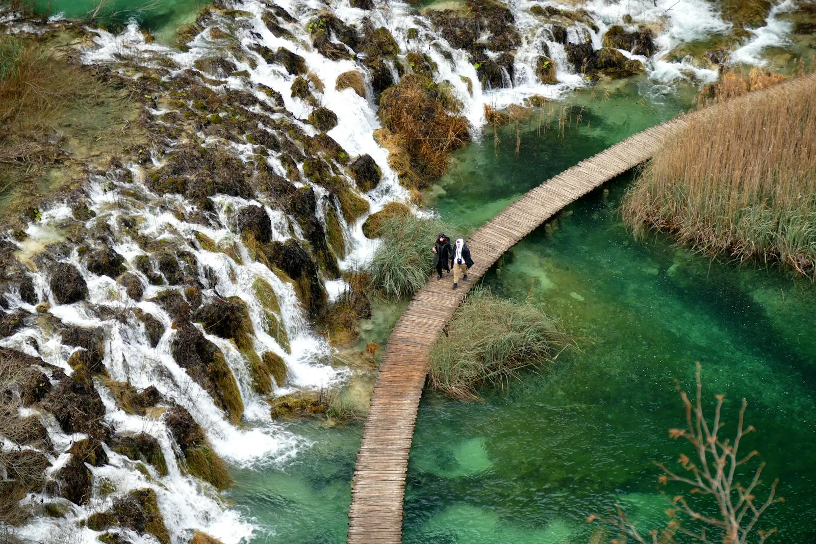 Plitvice Lakes boardwalk winding through turquoise cascading waterfalls