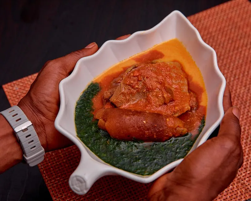 Dark green pondu (cassava leaf stew) in a bowl