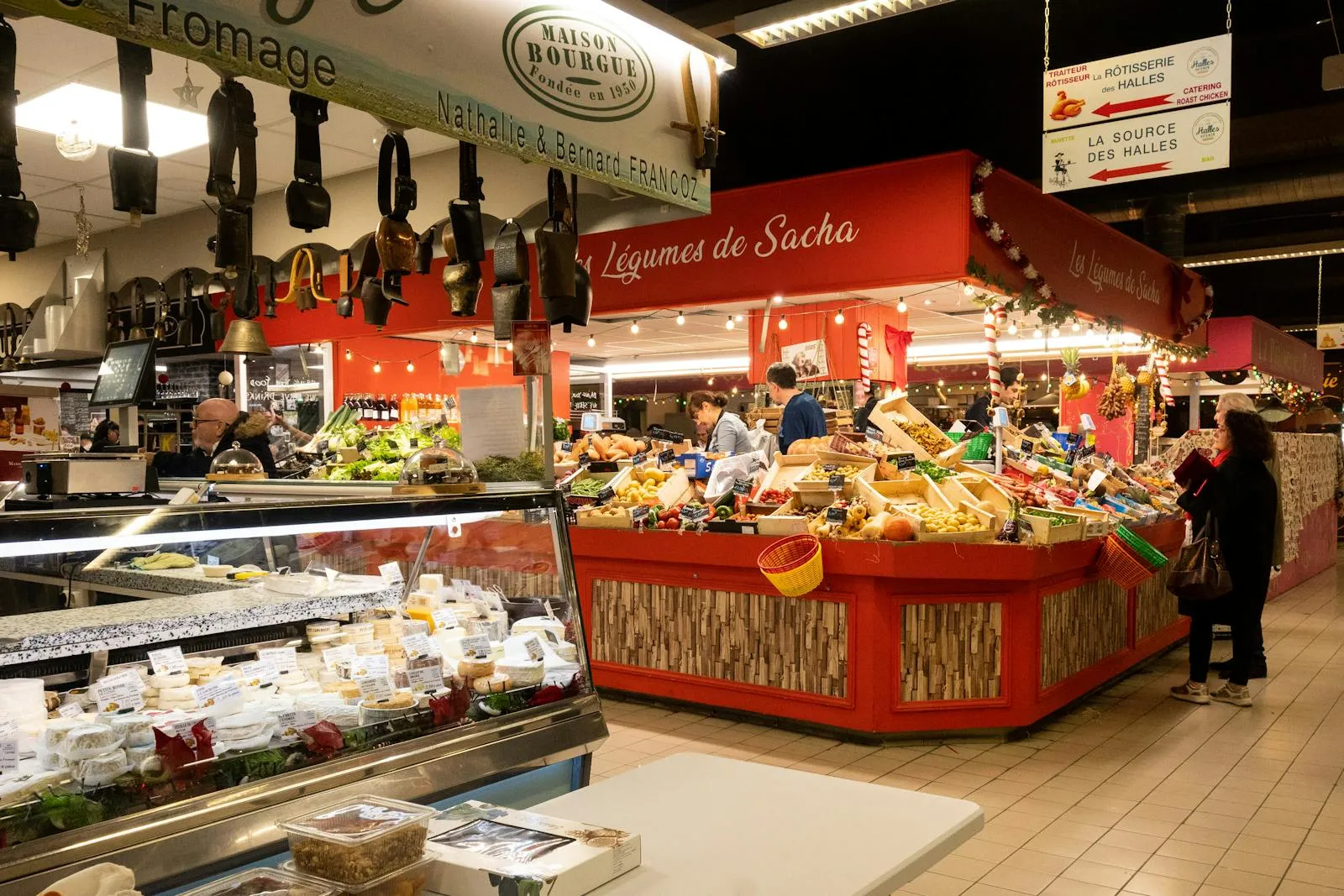 Traditional French market stall with cheese wheels and charcuterie