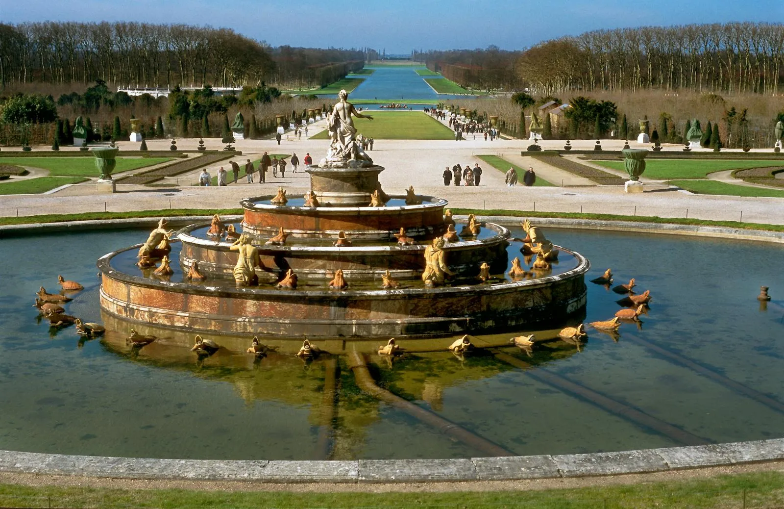 Palace of Versailles gardens with fountains and formal hedges