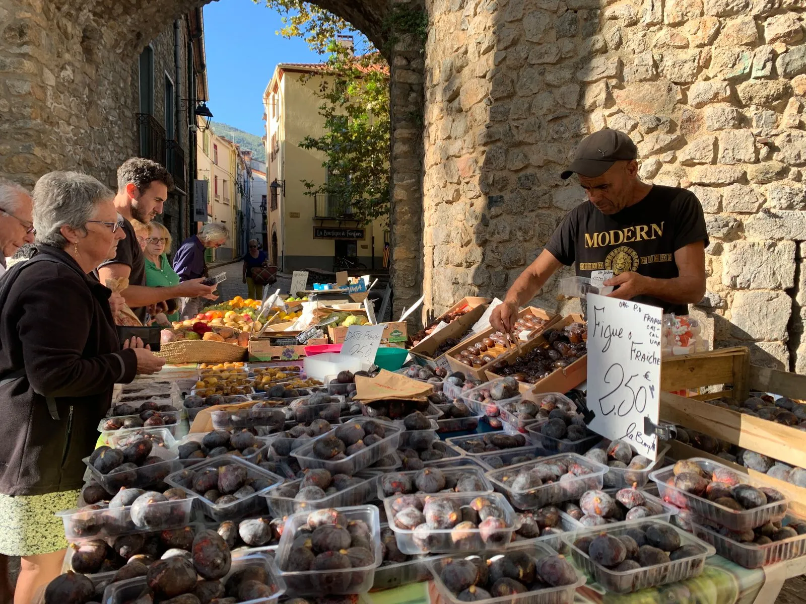 Bustling morning market in a French town square
