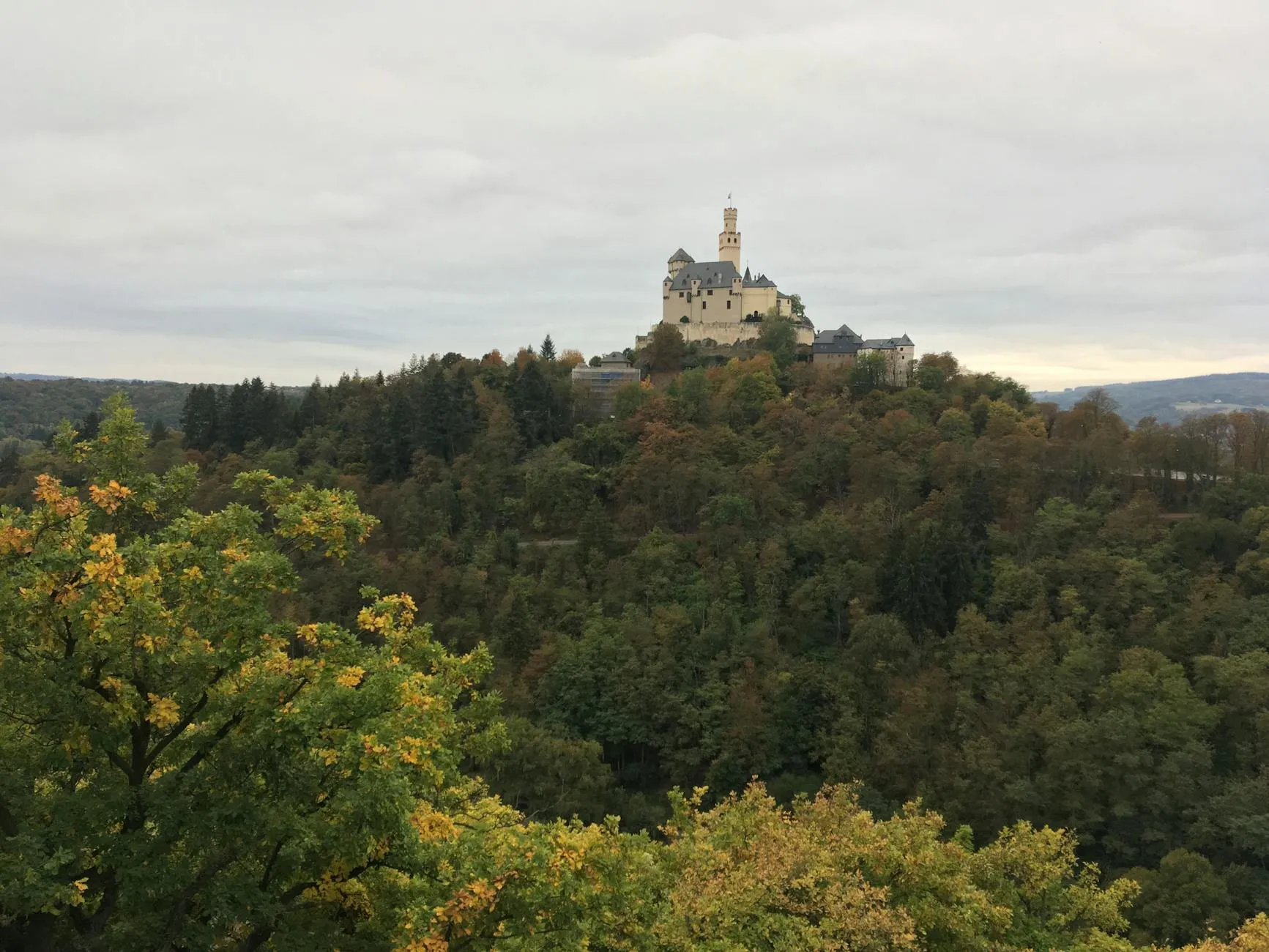 Autumn foliage in a German river valley with castle ruins