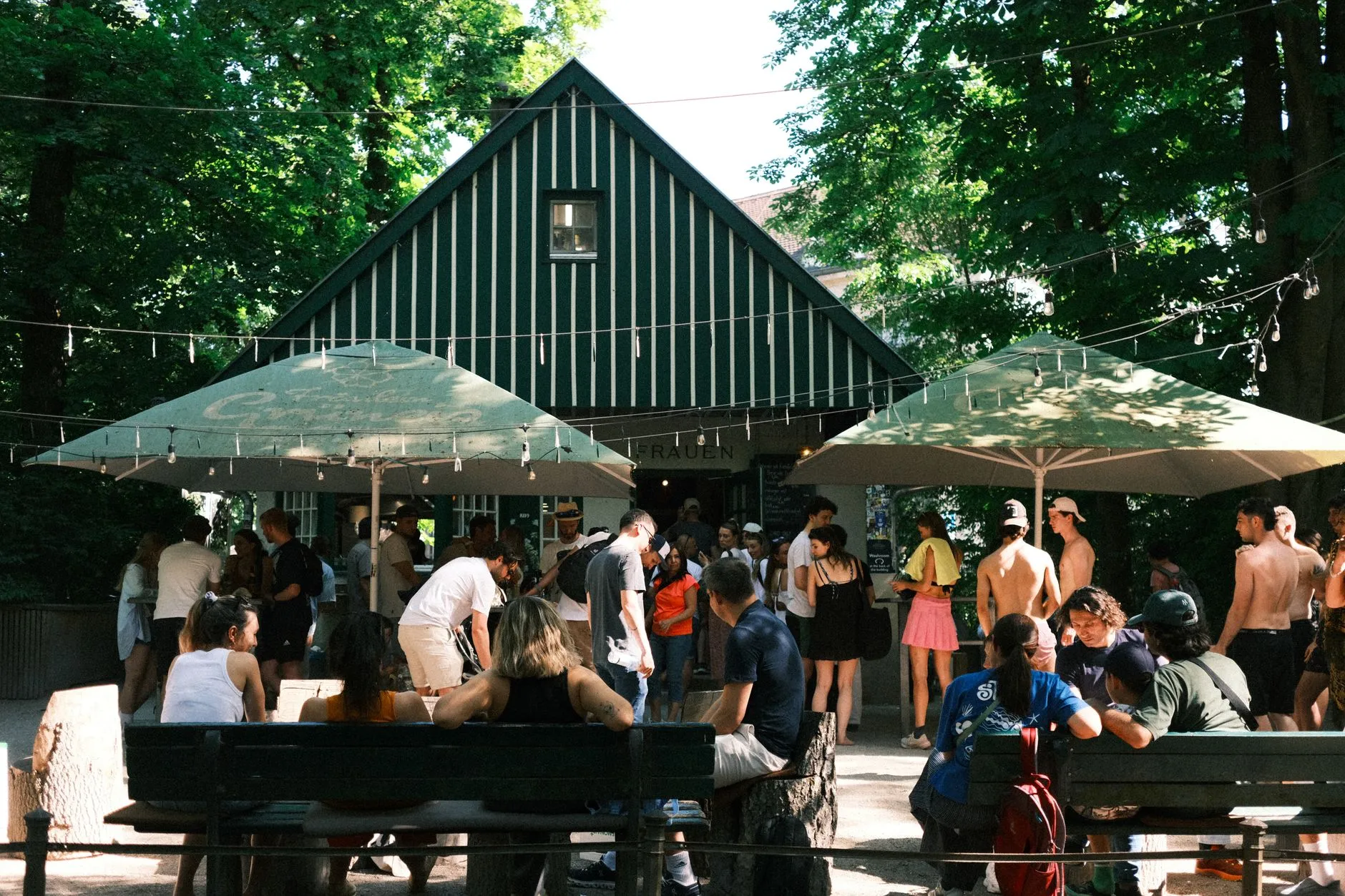 Traditional German beer garden with chestnut trees and long wooden tables