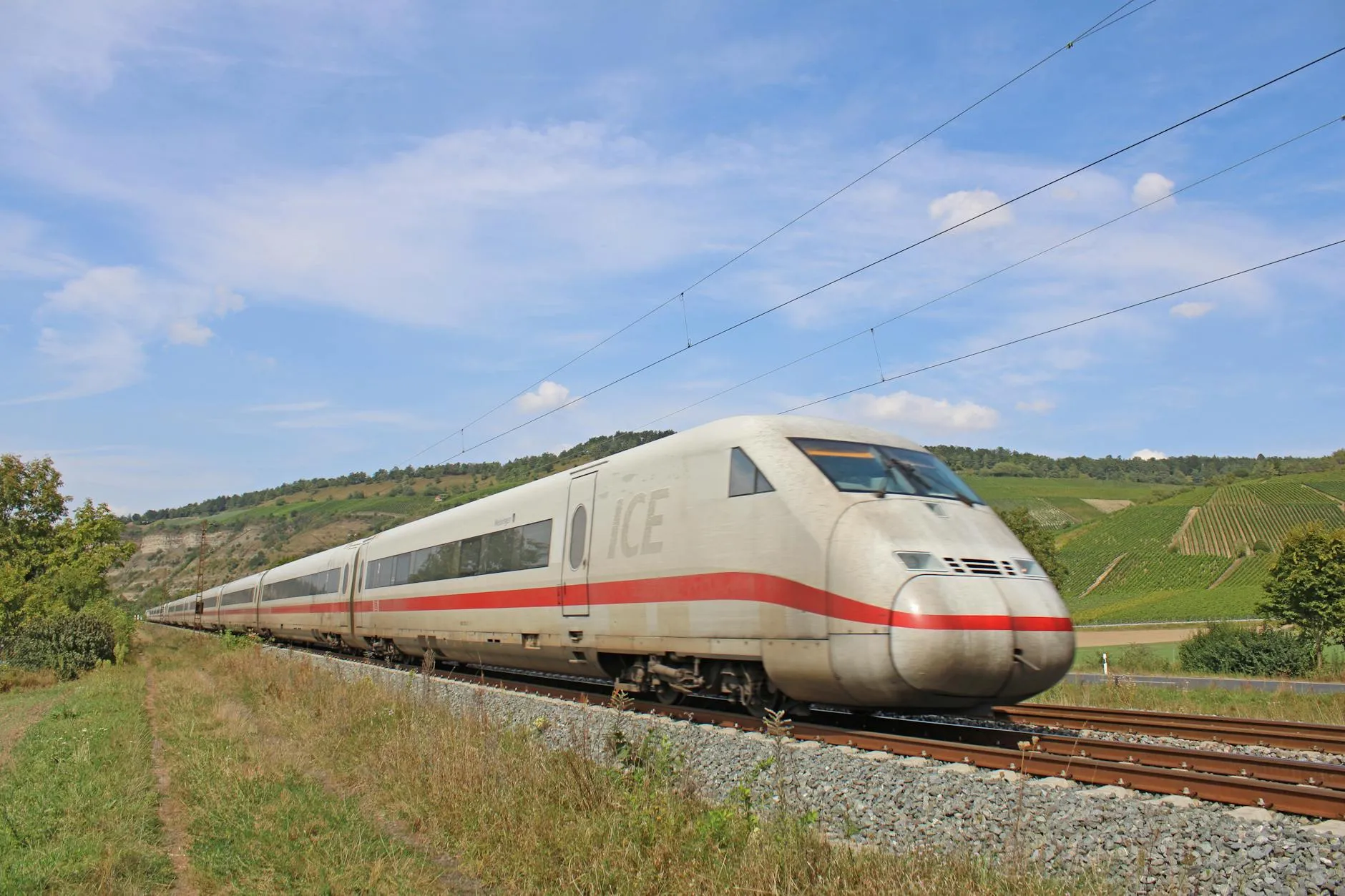 ICE train crossing a viaduct through German countryside
