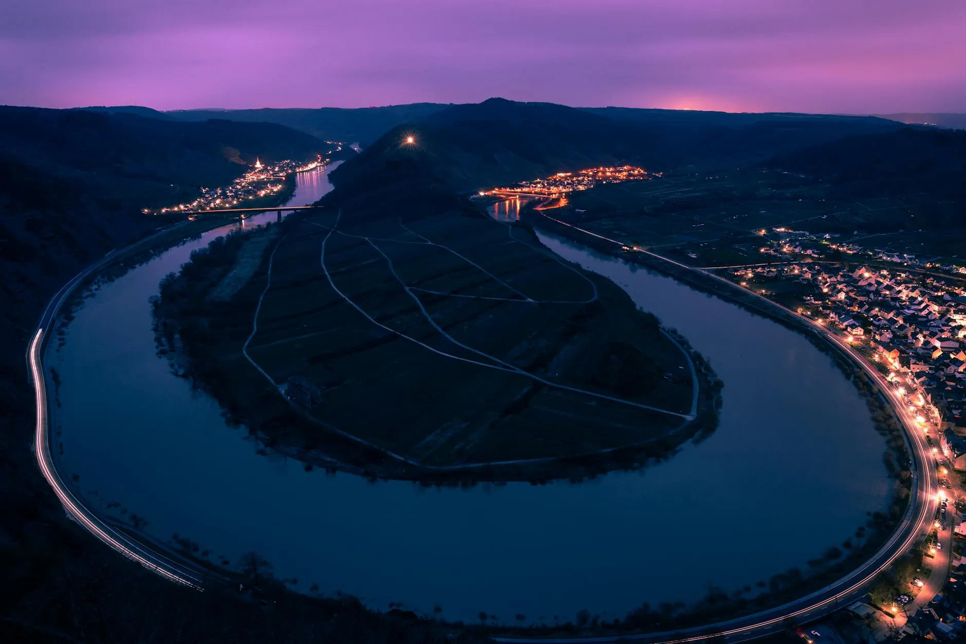 Mosel Valley vineyard terraces with river bend and village