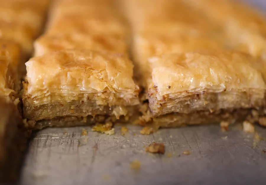 Layers of golden baklava dripping with honey and pistachios