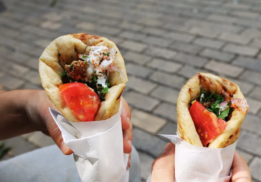 Greek souvlaki wrapped in warm pita with tomato and tzatziki