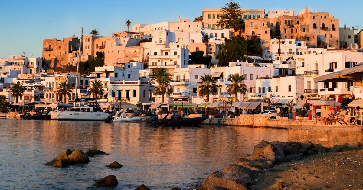 Panoramic view of a Greek island village cascading down to the harbour