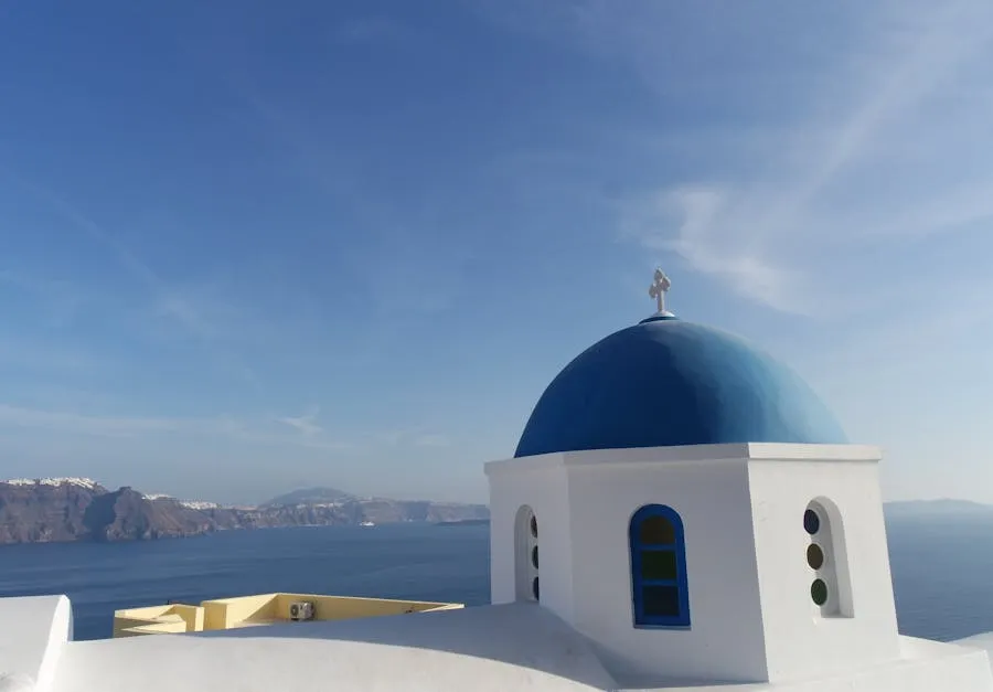 Blue-domed churches overlooking the Santorini caldera at sunset