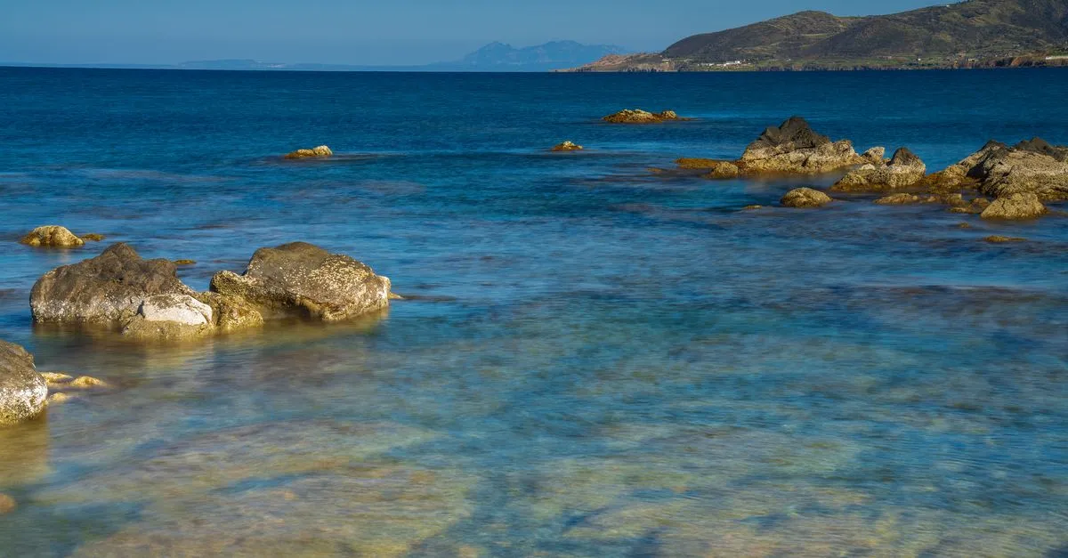Mediterranean coastline with crystal-clear waters and rocky shores