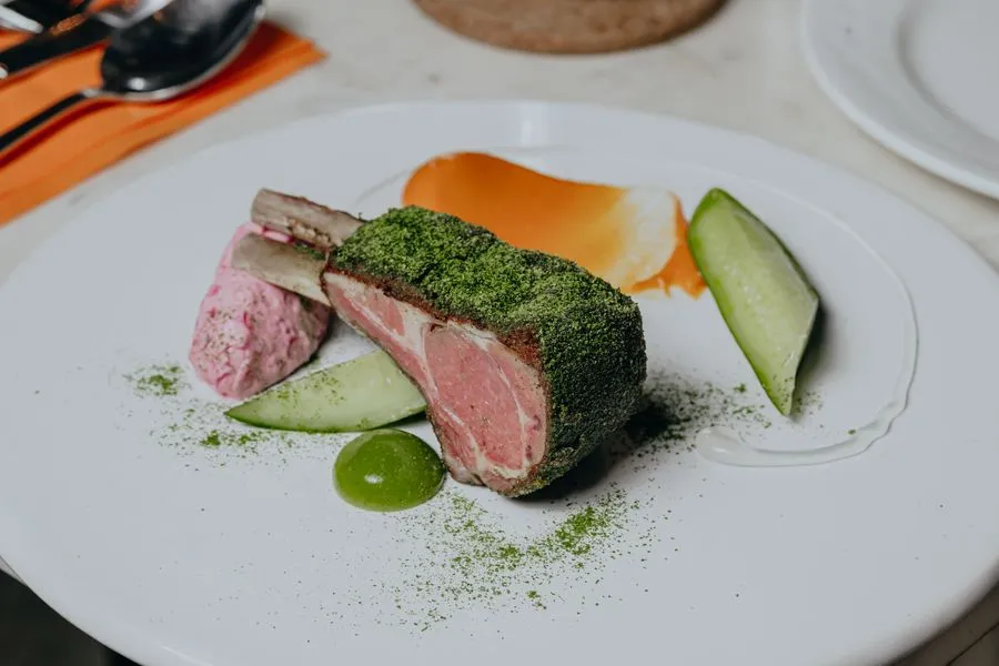 Herb-crusted lamb cutlet with fresh vegetables