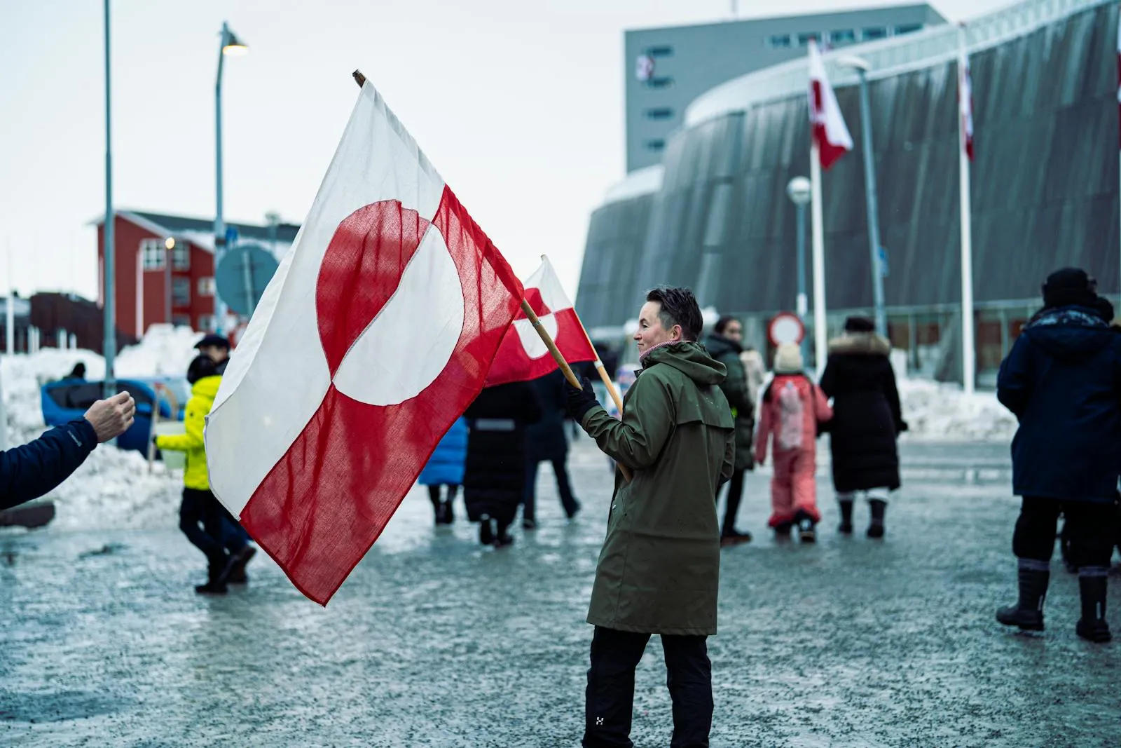 Traditional Greenlandic celebration with folk costumes and flags