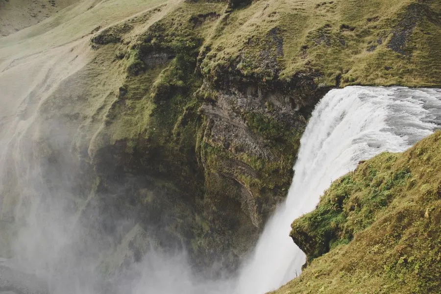 Dramatic Icelandic landscape with waterfalls and volcanic terrain