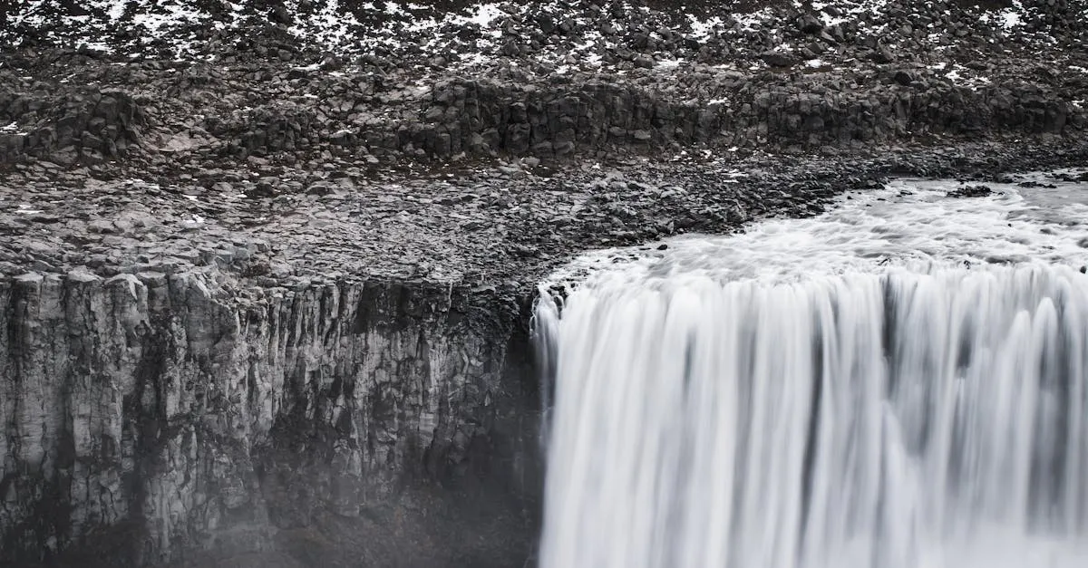 The immense Dettifoss waterfall thundering over rocky cliffs in northeast Iceland