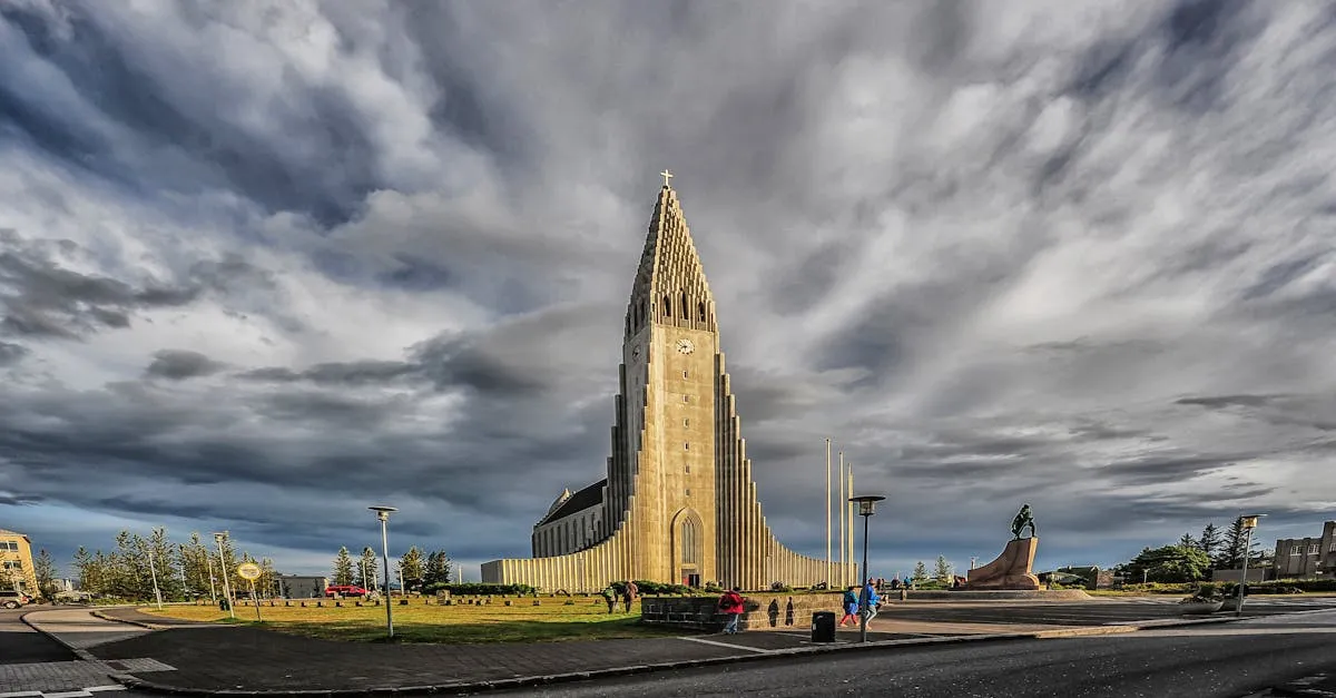 The towering concrete spire of Hallgrímskirkja church against dramatic clouds in Reykjavik