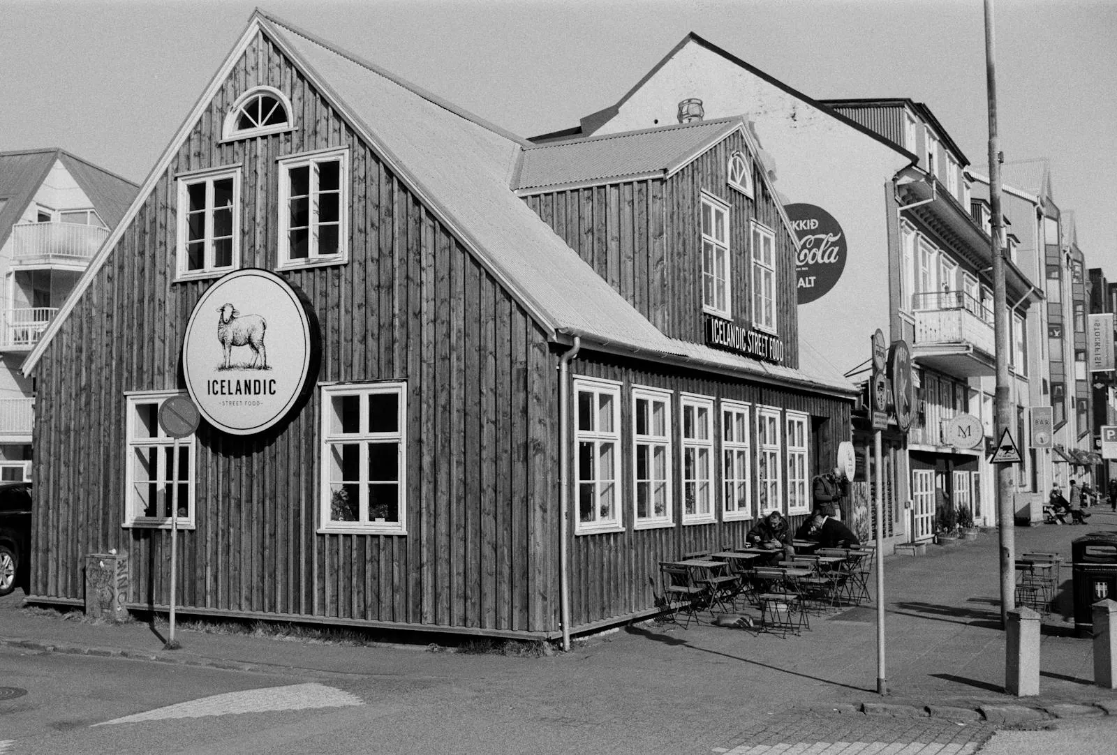 Cosy cafe scene on a Reykjavik street with warm lighting and Icelandic character