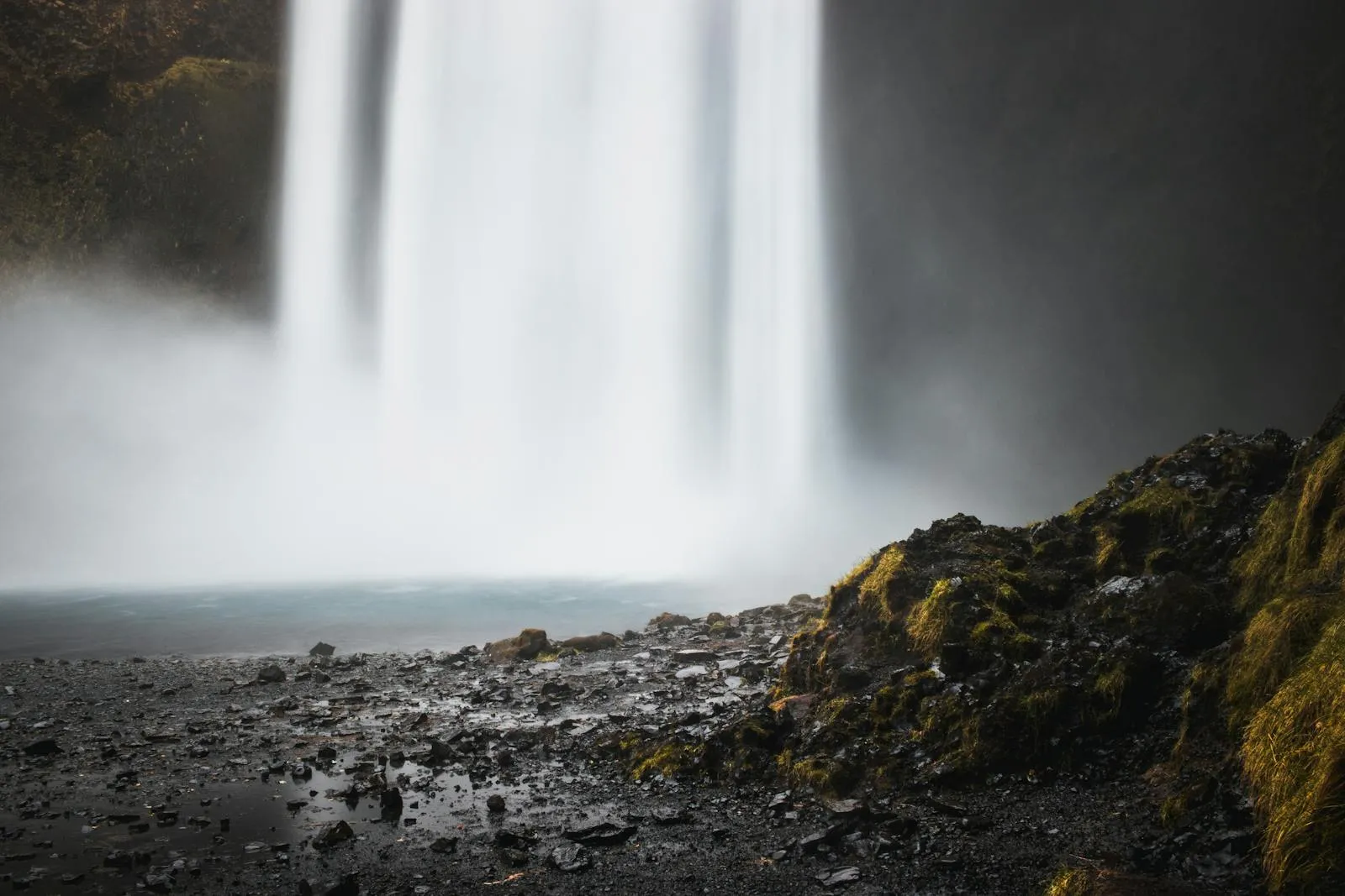 Iceland south coast scenery with black sand plains and distant waterfalls