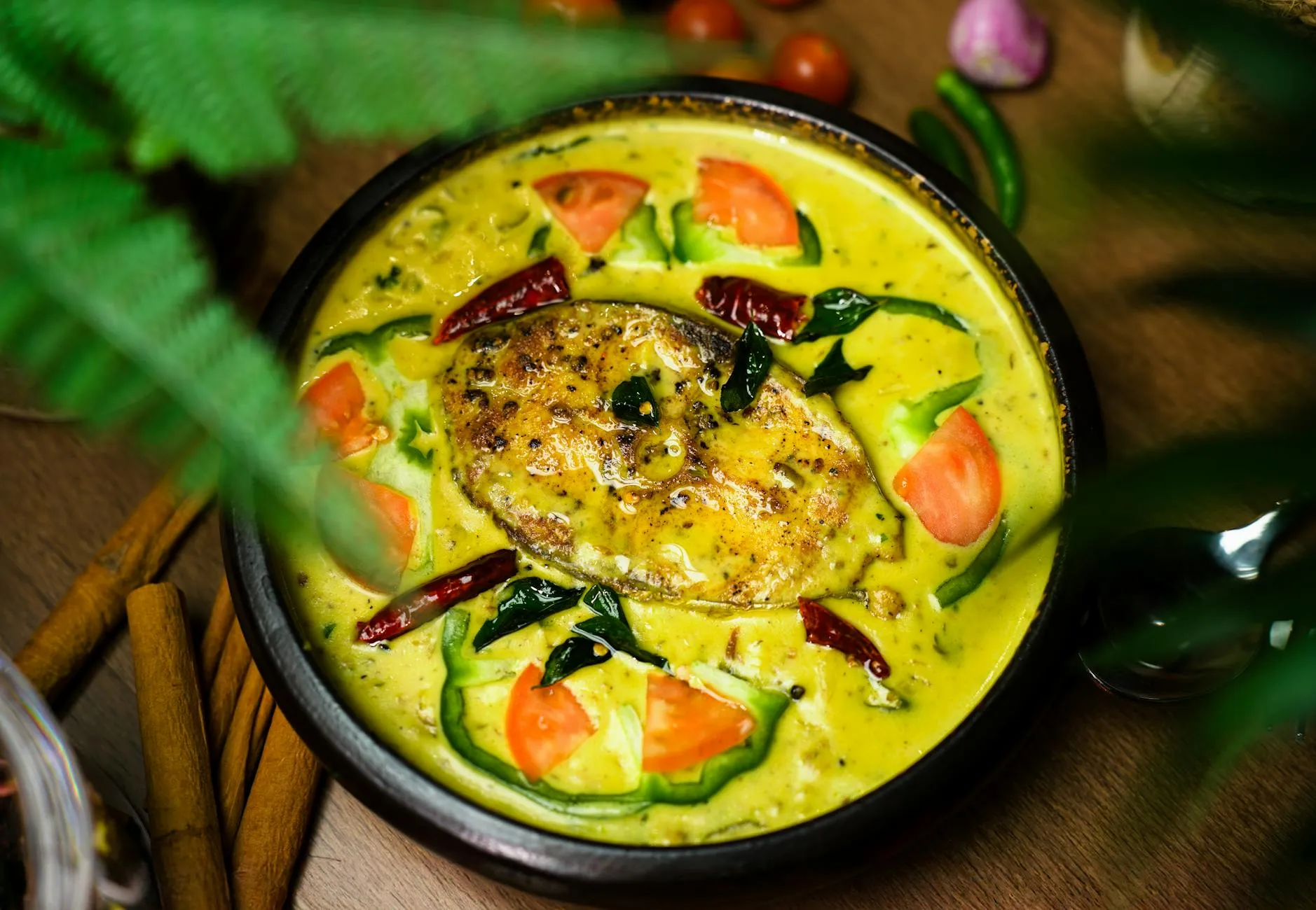 Kerala fish curry in coconut gravy on banana leaf