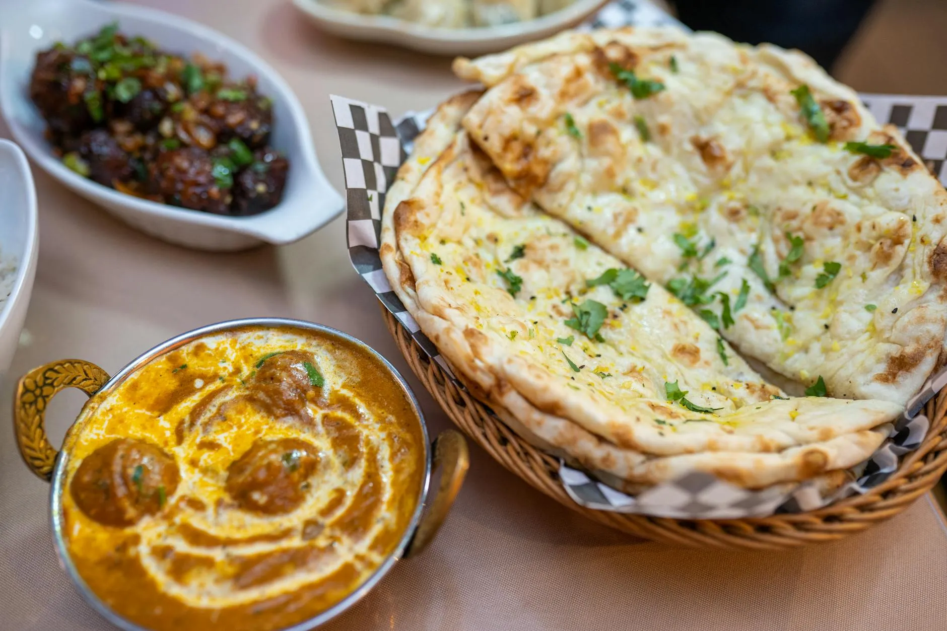 Butter chicken with naan bread and rice