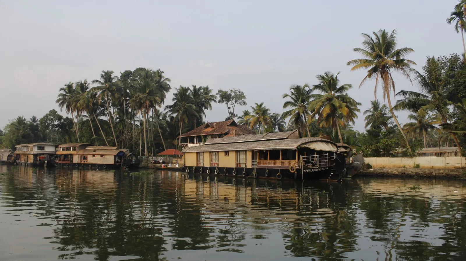 Traditional houseboat gliding through Kerala backwaters
