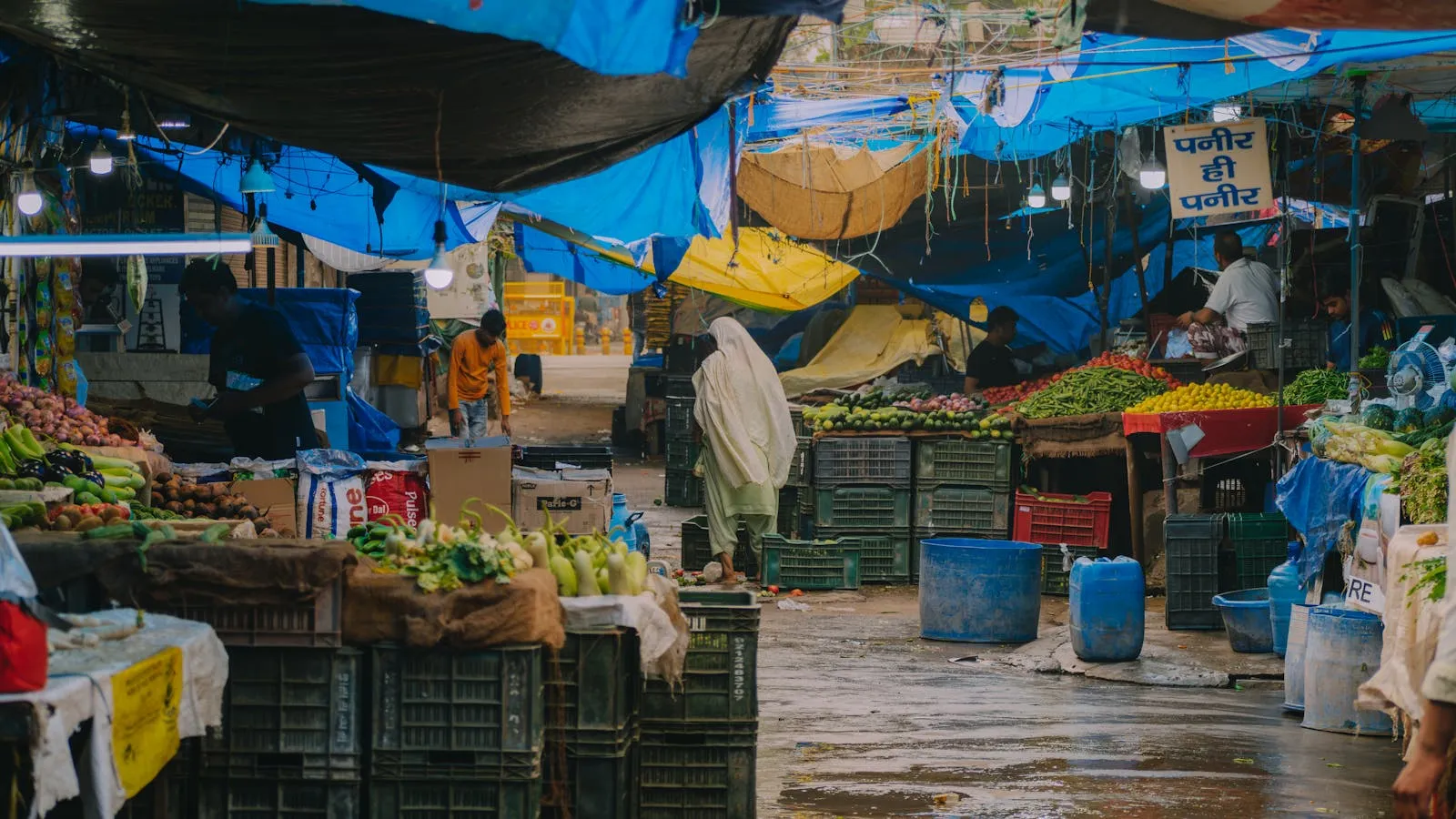 Colorful Indian street market with spices and textiles