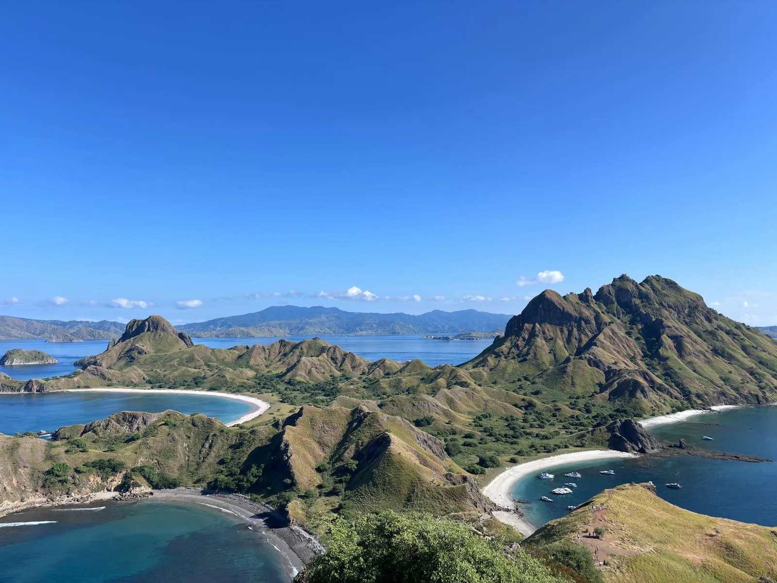 A stunning aerial view of Padar Island's rugged coastline and turquoise waters in Indonesia.