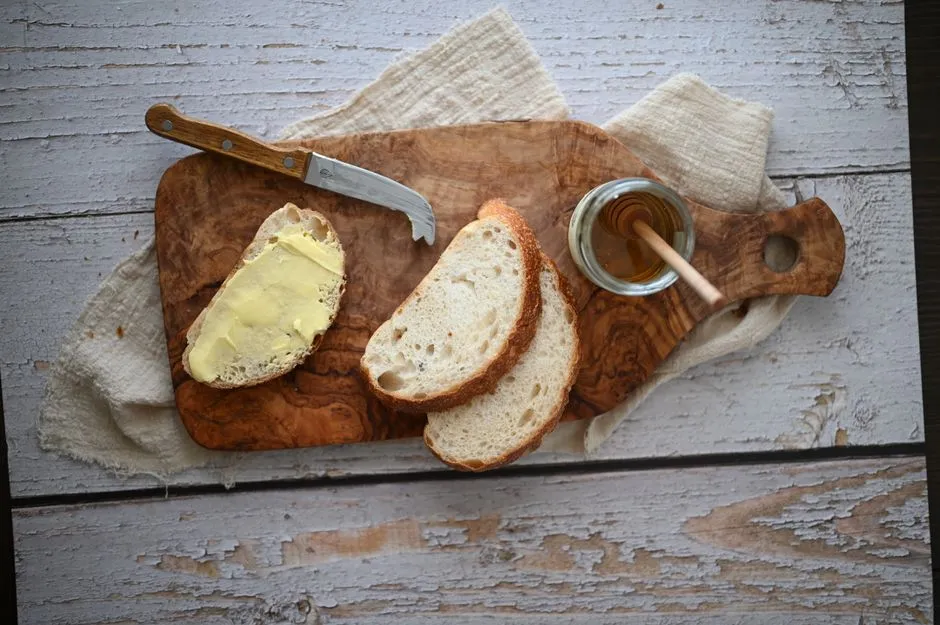 Freshly baked Irish soda bread on a wooden board with butter