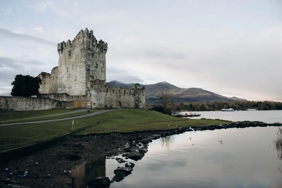 Ross Castle reflected in the still waters of Lough Leane in Killarney National Park