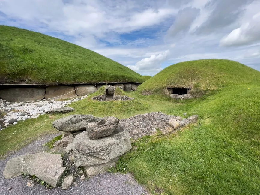 The circular stone mound of Newgrange with white quartz facade