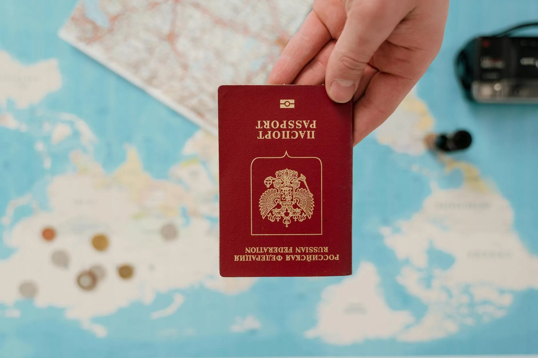 Passport and travel documents on a map of Ireland with a cup of tea