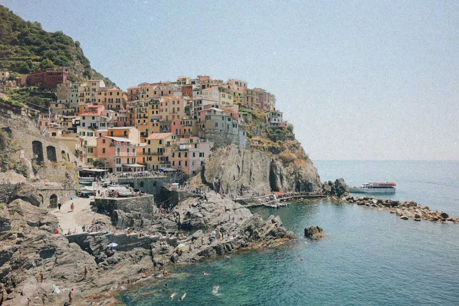 Pastel-coloured fishing village of Cinque Terre perched above the sea