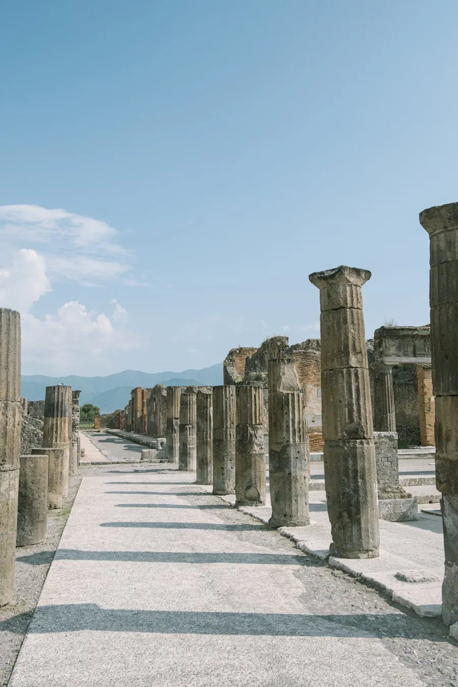 Ancient Roman ruins at Pompeii with Mount Vesuvius in the background