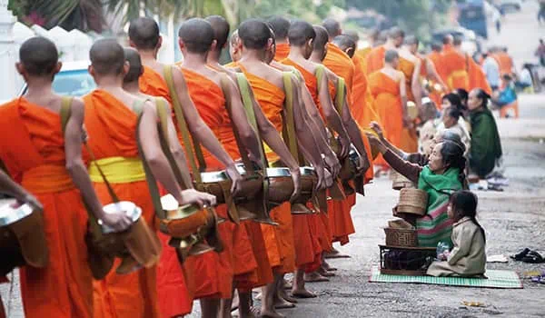 Monks collecting alms at dawn in Luang Prabang