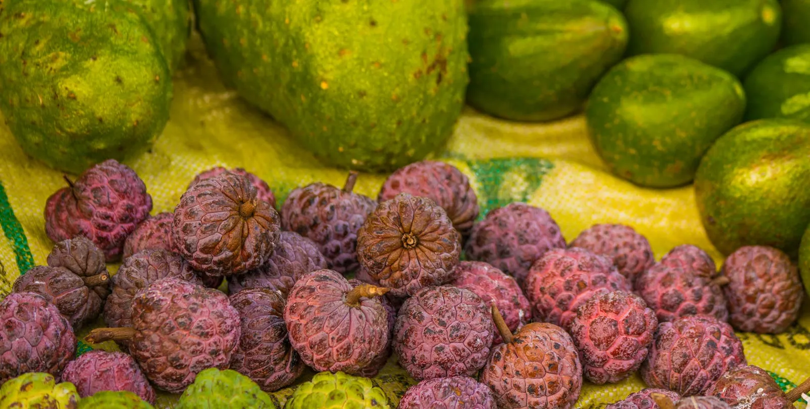 Colourful Malagasy market stall with tropical fruit and spices