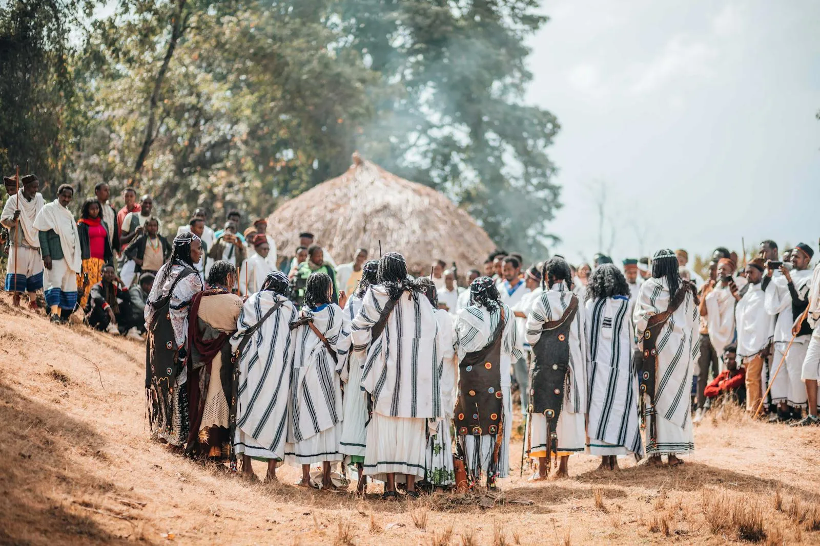 Malagasy women in traditional lamba cloth during a ceremony