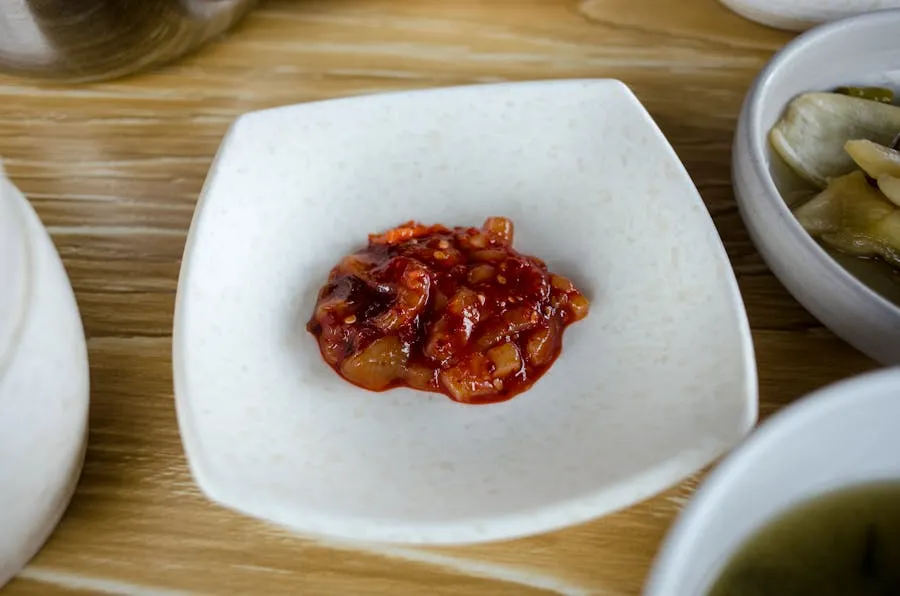Small bowls of lasary pickled vegetables and sakay chili paste