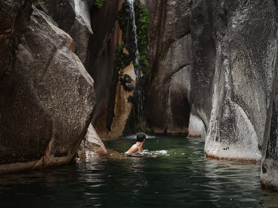 Natural swimming pool surrounded by sandstone cliffs in Isalo